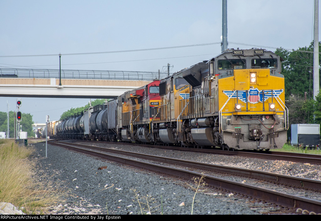 An eastbound manifest passes under Third Street